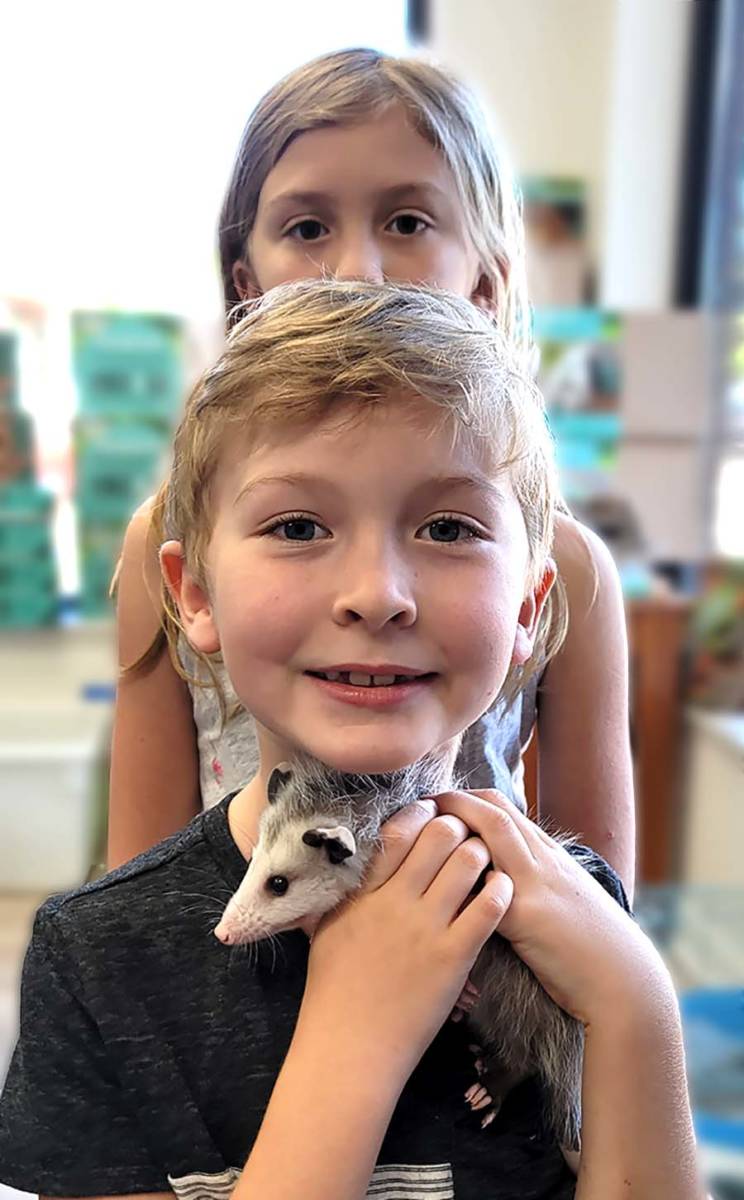 The Animal Store Pet Opossum with owners Jackson and Jianna
