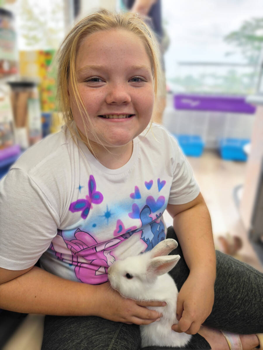 Sophia and her new pet rabbit from The Animal Store